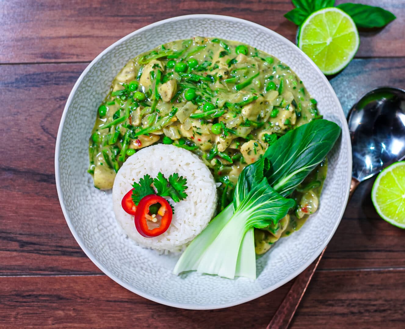 Top down image of Thai Green Curry in white bowl